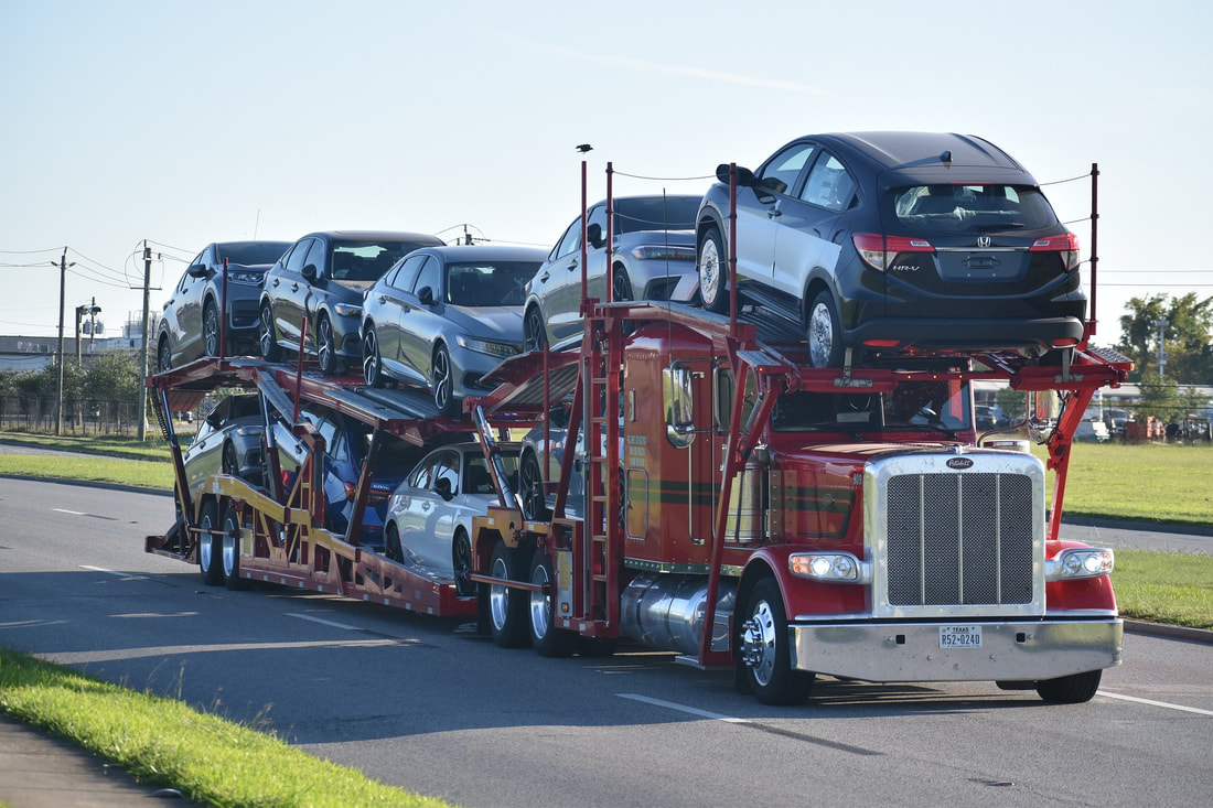 Double deck 10 car hauler fully loaded. 