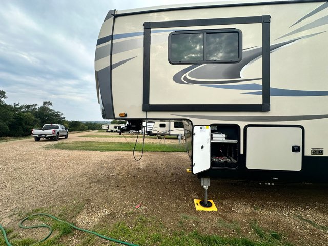 Ram truck pulling 5th wheel travel trailer as power only load. 