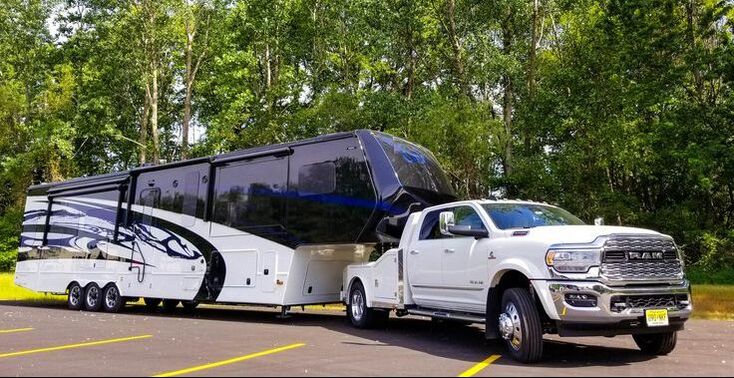 Ram truck pulling 5th wheel travel trailer as power only load. 