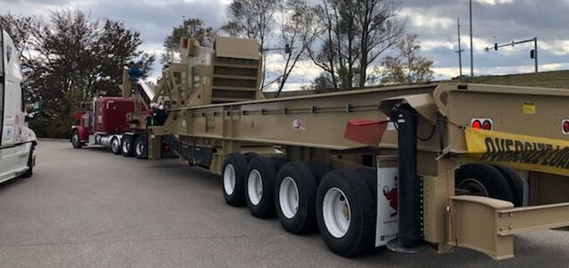 Semi pulling oversized conveyer trailer as power only load.