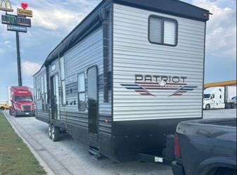 Ram truck pulling 5th wheel travel trailer as power only load. 